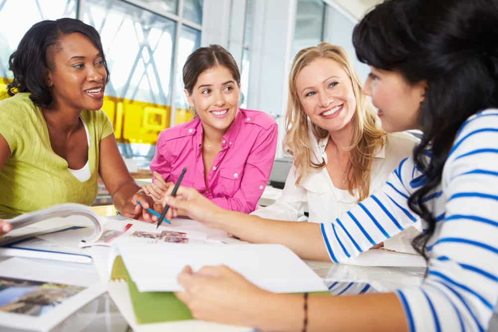 Group around a table with study materials