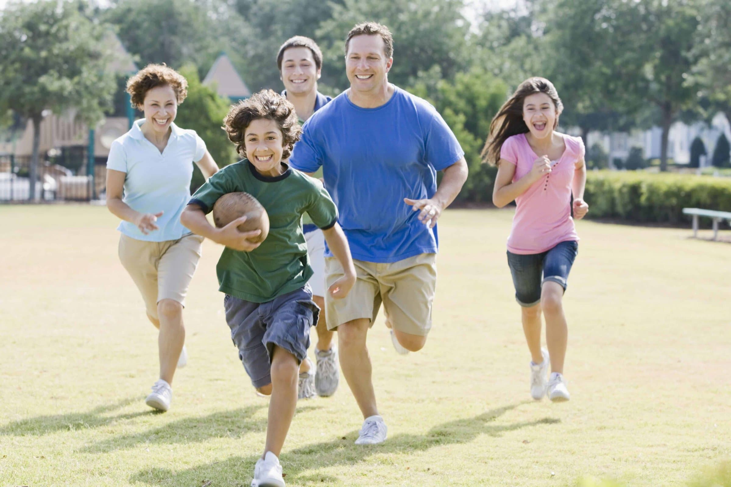 family_exercise_running_get_moving_family_football-min family_exercise_running_get_moving_family_football-min