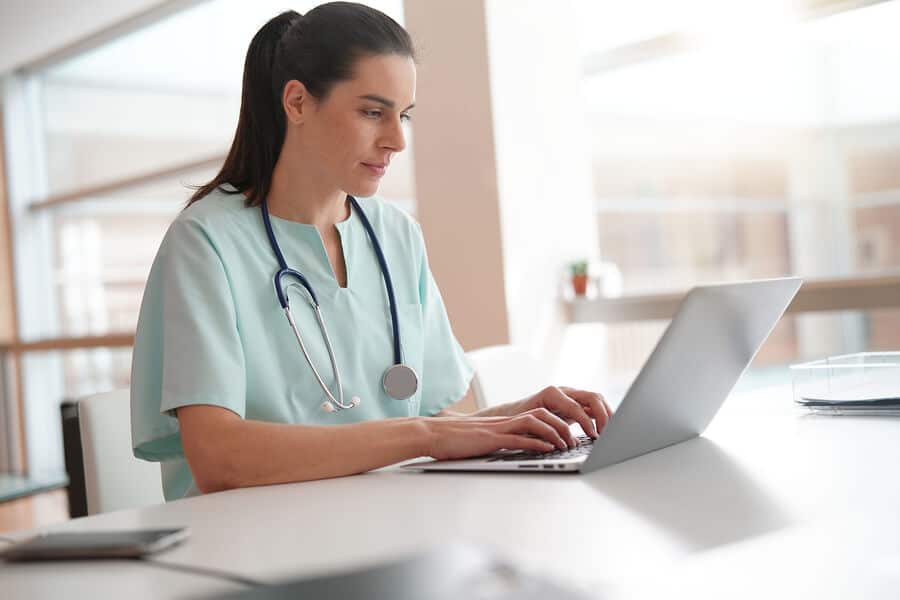 bigstock-nurse-working-on-laptop-comput-217221793