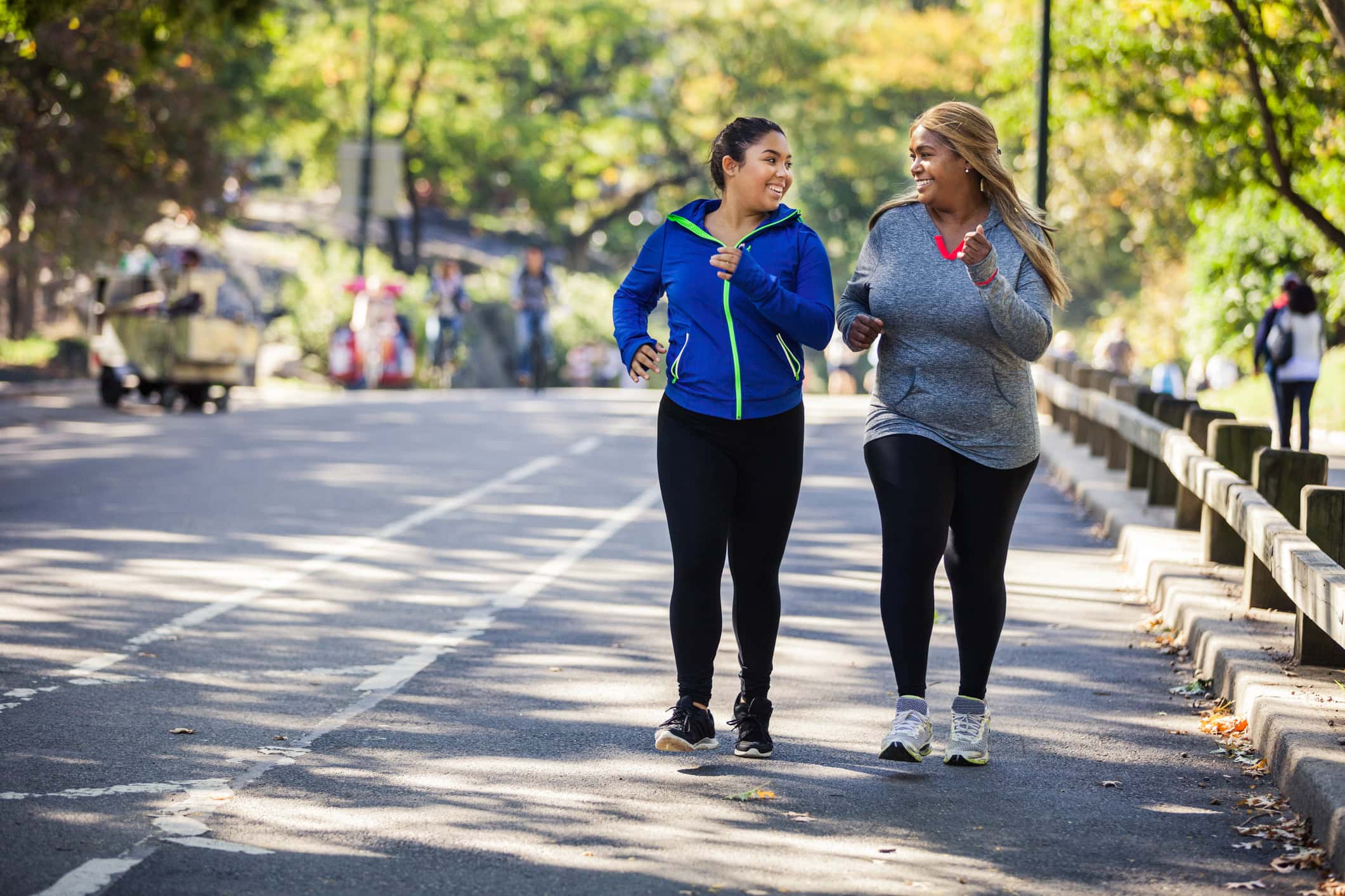 Women jogging in Central Park New York Two plus size women jogging in Central Park, New York during a beautiful day.