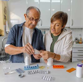 Man and woman with pills